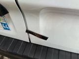 a close up of a car door with a sticker on it