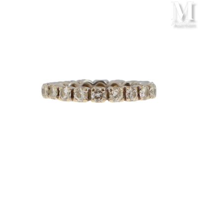 a close up of a diamond ring on a white background