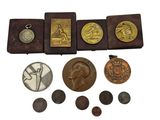 an image of a collection of coins and other items on a white surface