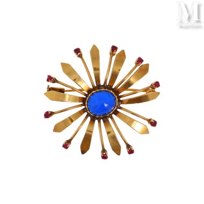 an image of a gold and blue broochle on a white background
