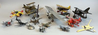 a lot of toy airplanes that are sitting on a table