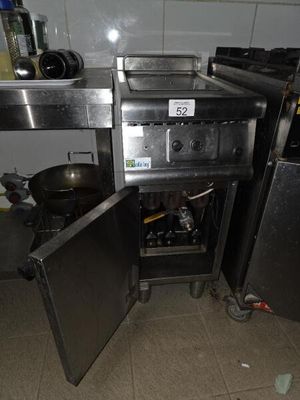 an image of a kitchen with a stove and a refrigerator