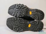 a close up of a pair of shoes on a white surface