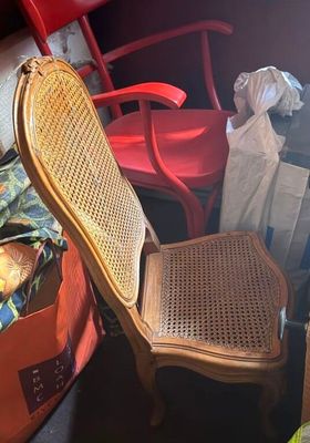 a chair that is sitting next to a chair in a room