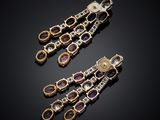 a pair of amethorate and diamond ear clips