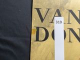 a picture of a book with a gold cover and a white bookmark