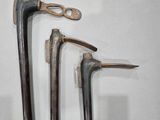 three different types of tools on display on a white surface