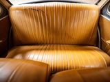 a brown leather seat in the back of a car