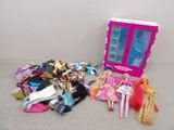 a lot of barbie dolls that are sitting on the floor