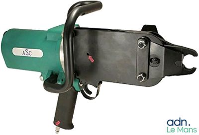 a close up of a green and black machine on a white background