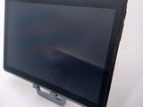 an image of a tablet computer sitting on top of a white table