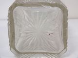 a clear glass bowl on a white surface