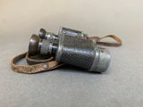 an old camera that is laying on the ground