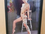 a picture of a naked woman sitting on a chair