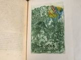 an open book with a picture of a flower on it