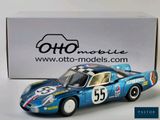 the model of a blue race car sits in front of a box
