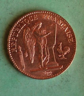 an image of a penny that is sitting on a green surface