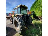 a tractor that is parked on the side of the road