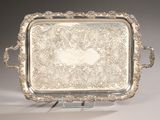 rectangular silver tray with ornate design and handles
