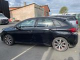 a black car that is parked in a parking lot