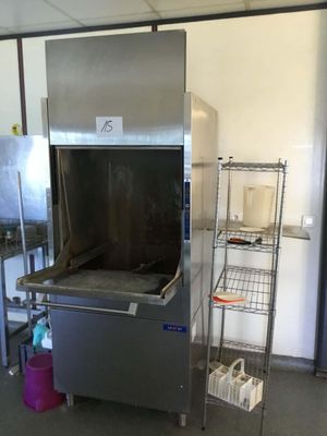 a large stainless steel oven in the middle of a kitchen