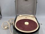 a suitcase that has a record player inside of it