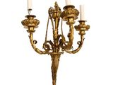 antique brass wall sconce with five arms and a candle holder