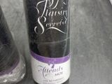 a bottle of wine and a pair of scissors on a table