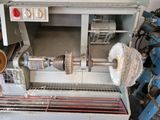a picture of a machine that is working on a piece of metal