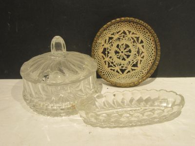 two glass dishes and a bowl on a table