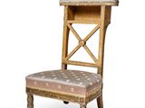 an image of a wooden chair with a patterned seat and back