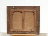an old wooden easel with a painting hanging on it ' s side