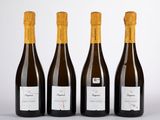 trois bouteilles de vin posées l'une à côté de l'autre sur une table