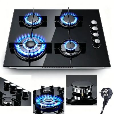 a black stove top with blue flames on it