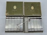 two boxes of cigarettes are sitting next to each other on a table
