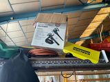 a box on top of a shelf with tools on it