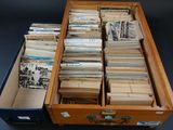 a suitcase full of old records on a table