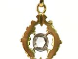 gold plated pendant with a faceted facet of a diamond