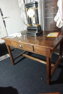 a wooden table with a clock on top of it