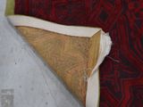 a piece of fabric that has been torn off of a rug