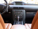 the interior of a car with a dashboard and steering controls