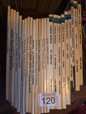 a lot of books that are on a shelf