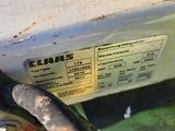 a close up of a gas pump on the side of the road