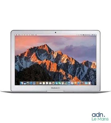 an apple macbook air laptop computer with a mountain range in the background