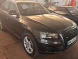 an image of a black audi suv parked in a garage