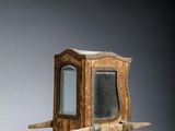 pair of small wooden boxes with a mirror on top of them