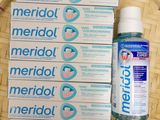 several boxes of merrolol and a bottle of water on a basket