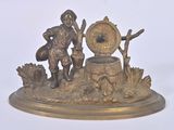 bronze figurine of a boy with a water well and a bird