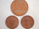three different types of coins are shown on a white surface