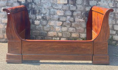 a wooden bench that is sitting in front of a stone wall